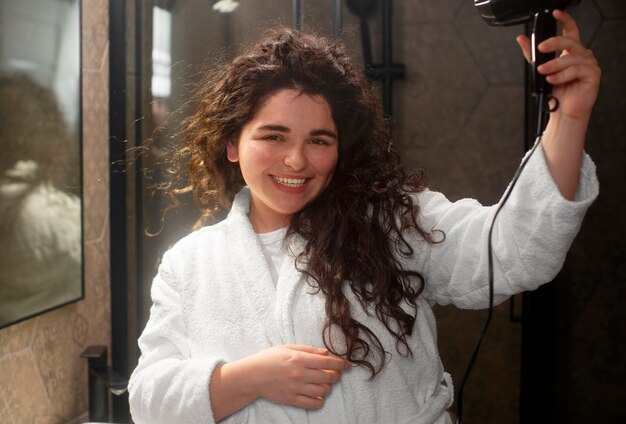 Medium shot young woman with curly hair