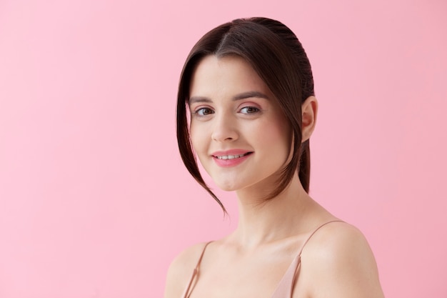 Medium shot young woman with pink background