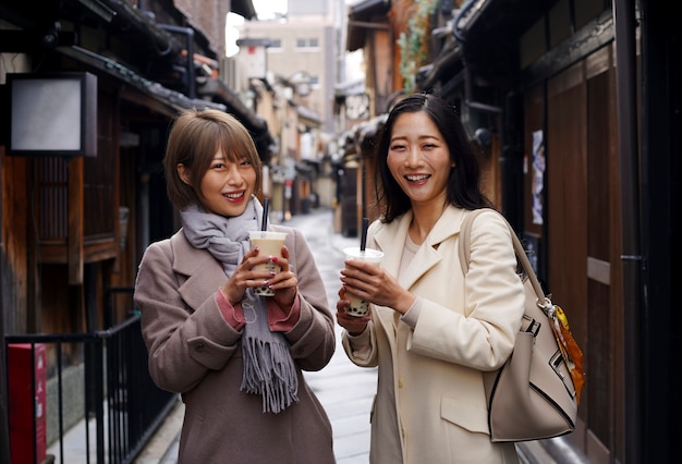 Medium shot young women with bubble tea