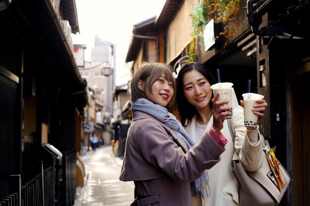 Medium shot young women with bubble tea