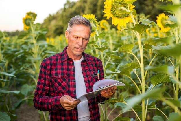 Medium view man reading from a clipboard