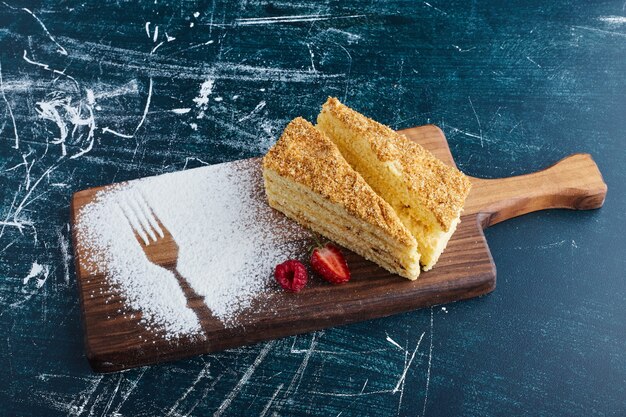 Medovic cake on a wooden board, top view. 