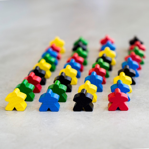 Meeple board game pieces on desk