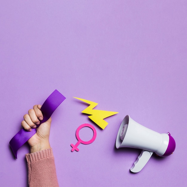 Megaphone and woman's hand copy space