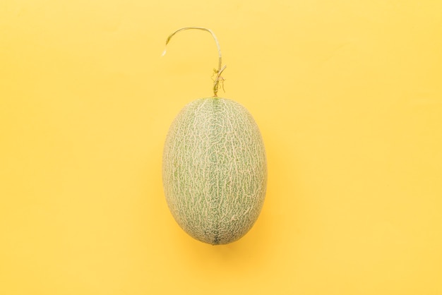 Melon on yellow background