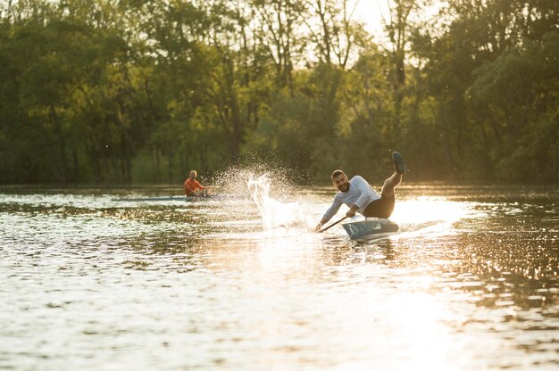 Men in canoe rowing concept