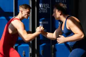 Free photo men demonstrating wrestling combat moves