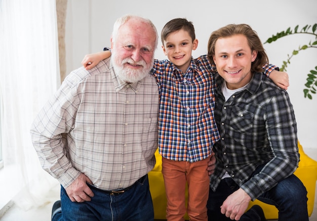 Free photo men of different generations embracing