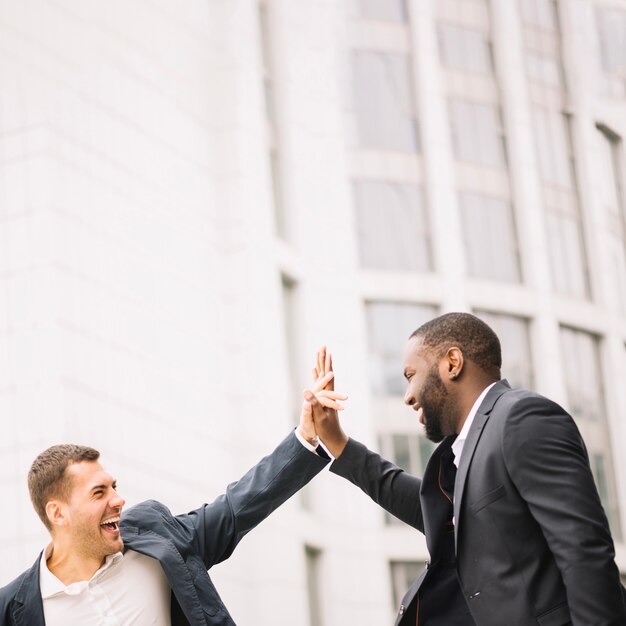 Men giving high five