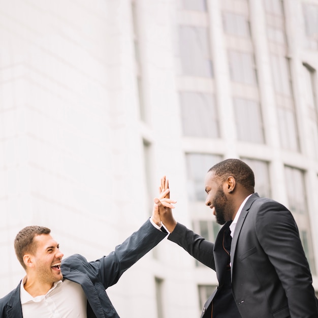 Men giving high five