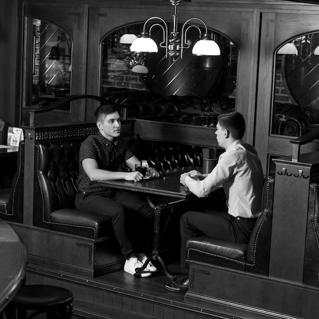 Men having conversation in cafe