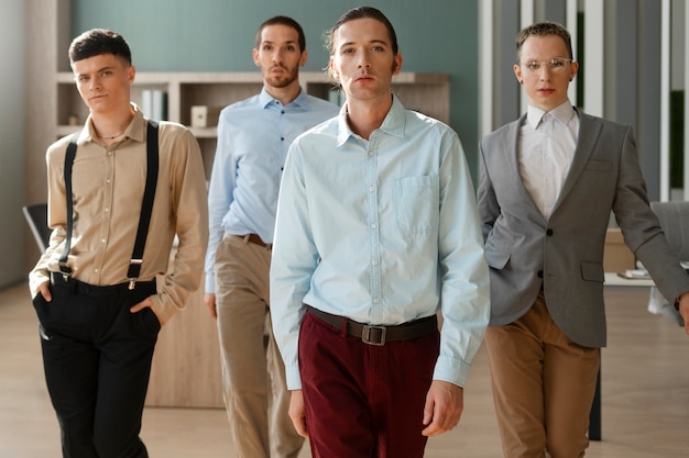 Free photo men performing vogue dance indoors