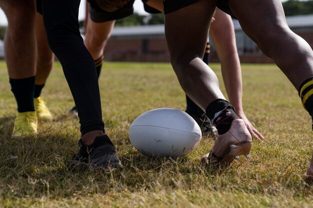 Men playing rugby on the field