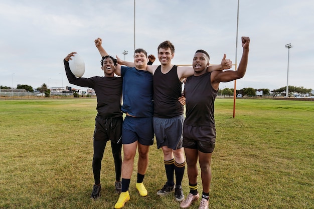 Men playing rugby on the field