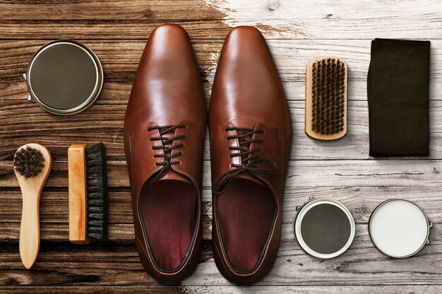Men&amp;rsquo;s leather shoes flat lay with polishing tools