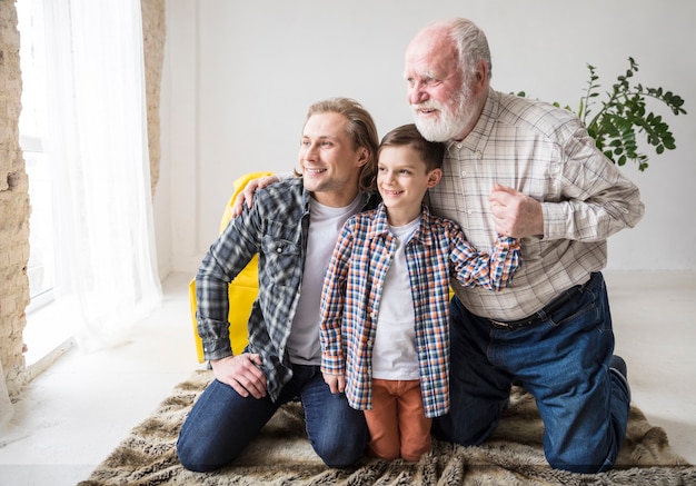 Free photo men sitting on carpet and looking away