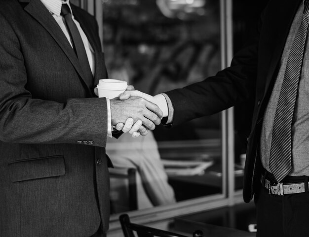 Men in suits shaking hands