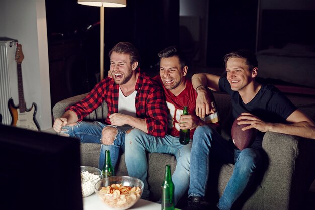 Men watching american football competition