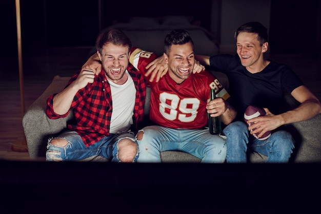 Free photo men watching american football competition