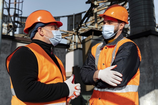 Free photo men wearing masks medium shot