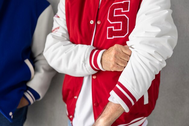 Men wearing varsity jacket