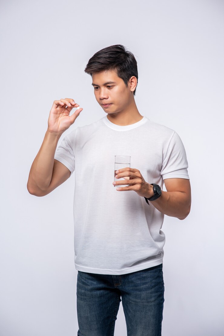Free Photo men who are sick and are about to take antibiotics
