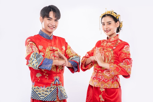 Free Photo men and women wear qipao to pay their respects. isolated on white background