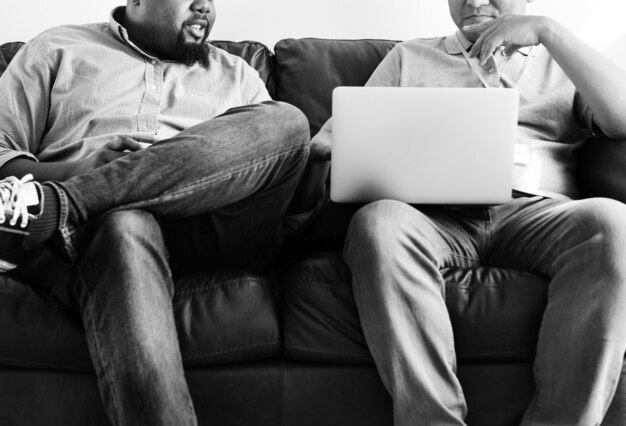 Men working on laptop