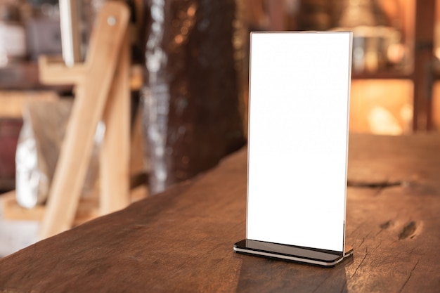 Menu frame standing on wood table in coffee shop. space for text marketing promotion  