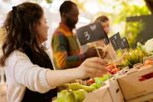 Free photo merchant puts price tags on produce boxes