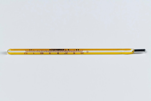 Free photo mercury thermometer on a white background