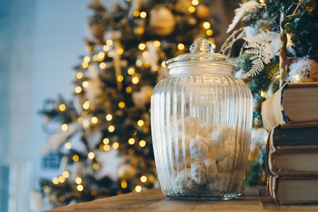 Meringue in a glass jar as part of the christmas interior Premium Photo