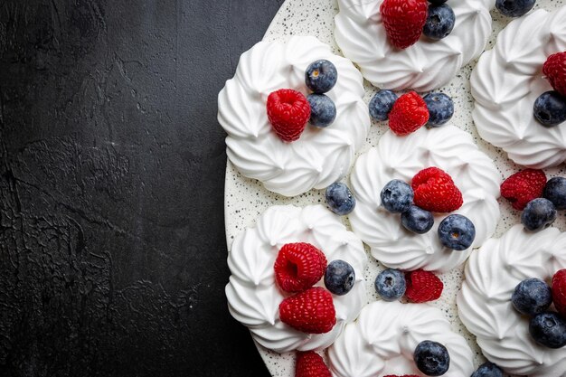 Meringues cakes with berries