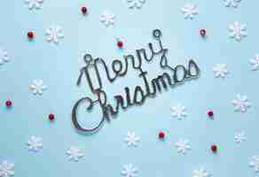 Free photo merry chistmas sign with snowflakes