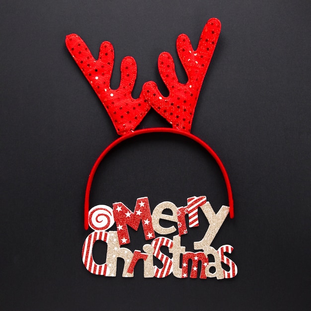 Free photo merry christmas concept with reindeer headband