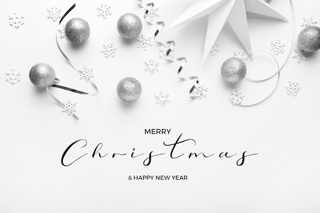 Merry christmas and happy new years greetins with silver tones on a white elegant background