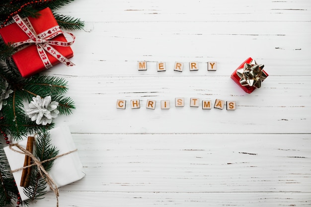 Free photo merry christmas lettering of wooden blocks