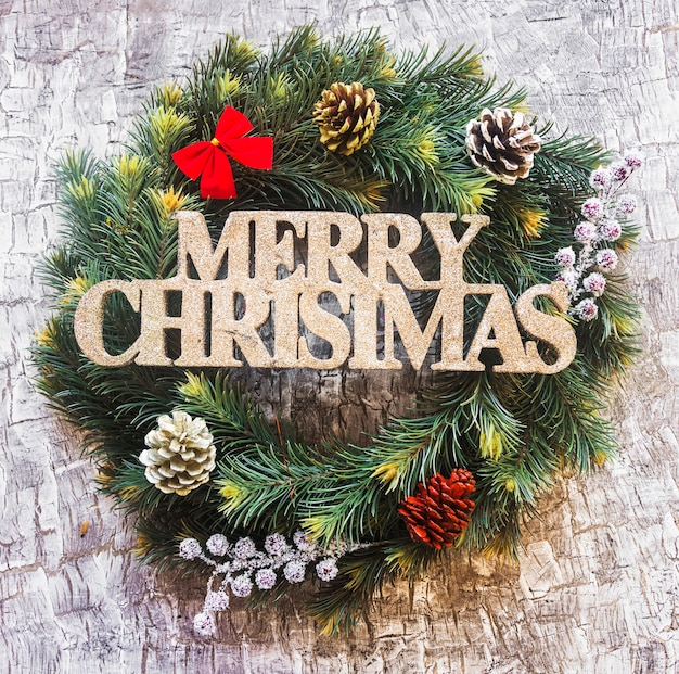 Free photo merry christmas title on wreath