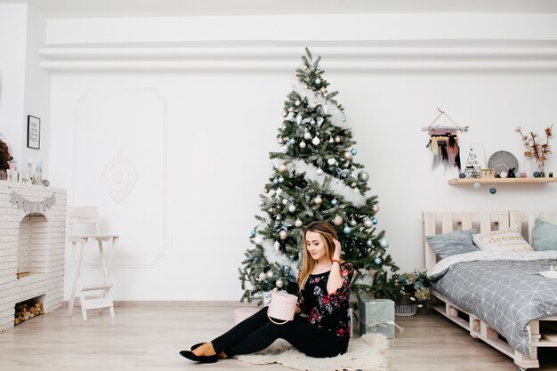 Merry Christmas. Young woman celebrating Christmas 