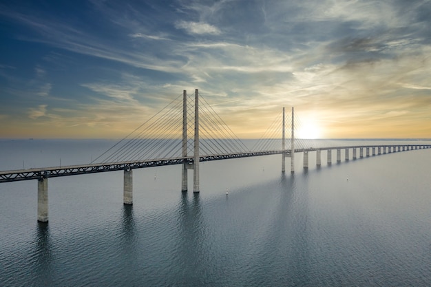 Mesmerizing aerial view of the bridge between denmark and sweden under the cloudy sky