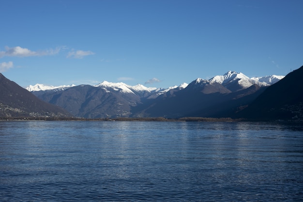 Mesmerizing picture of a lake against prodigious mountains at daytime