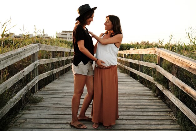 Mesmerizing shot of a lovely pregnant couple - lesbian family concept