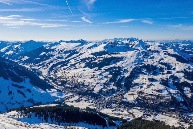 Free photo mesmerizing snow-covered mountains under a blue sky