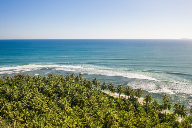 Mesmerizing view of the coastline with white sand and turquoise clear water in Indonesia