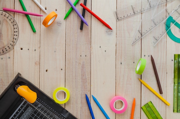 Mess of school supplies on wood