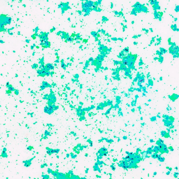 Messy green color powder on white surface background