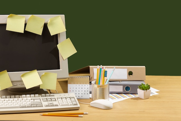 Messy office desk with old computer still life