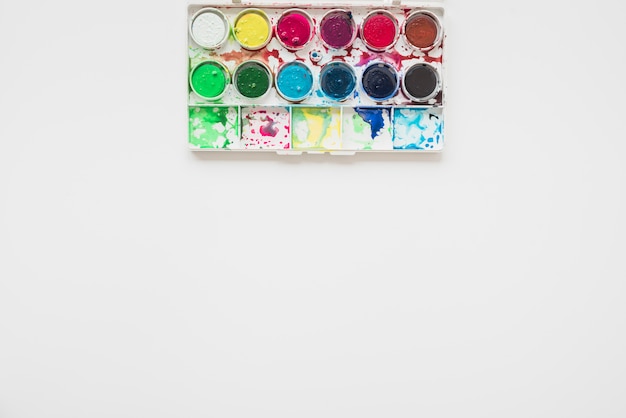 Messy watercolor palette isolated on white background