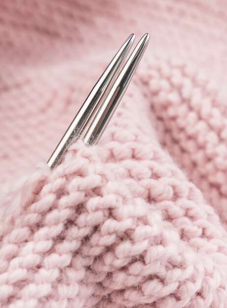 Metal crocheting needles and pink crochet