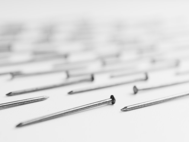 Metal nails on table